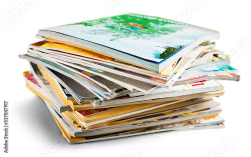 Stack of magazines on white background