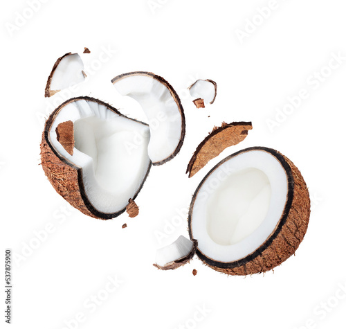 Crushed coconut close up in the air isolated on white background