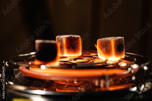 Close up of red hot cubes on hookah