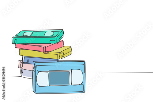 One single line drawing stack of retro old classic vhs analog video cassette. Vintage film storage tape item concept continuous line graphic draw design vector illustration