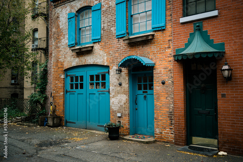 Beautiful brick house with blue doors, on Hunts Lane in Brooklyn Heights, Brooklyn, New York