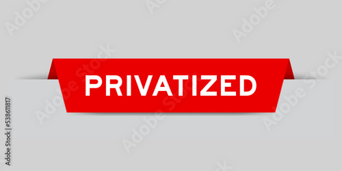 Red color inserted label with word privatized on gray background