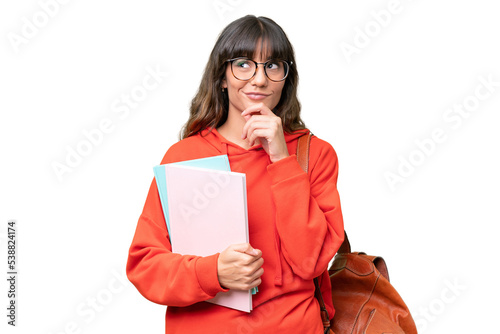 Young student caucasian woman over isolated background and looking up