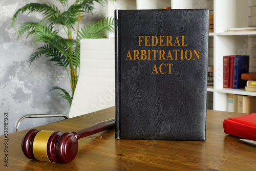 Federal arbitration act on the wooden surface.