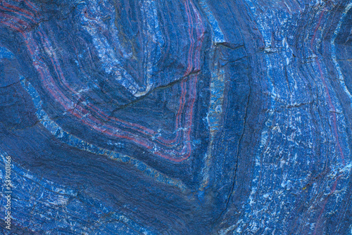 The texture of an iron ore mineral rock, a type of iron ore with impurities. The texture of a natural stone.