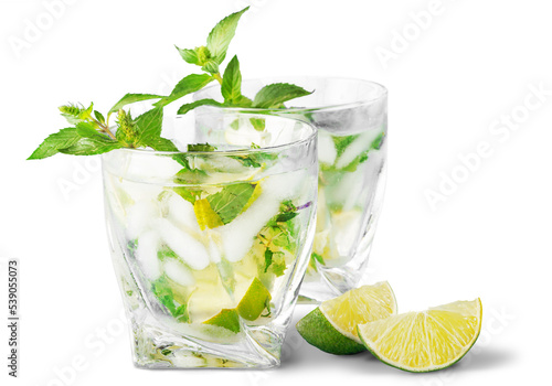 Cold mojito drink, glass of alcohol isolated over white background, fresh mint and lime fruit slice, food still life, party and holidays celebration