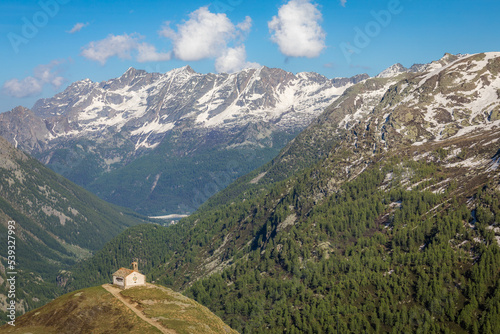 Chapel church above Idyllic Dolomites Alpine landscape, Gran Paradiso, Italy