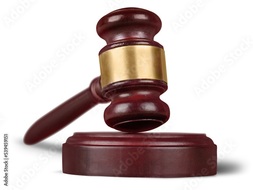 Wooden gavel on wooden table, on background