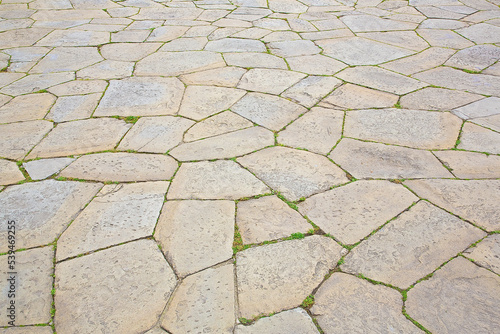 Typical traditional urban italian stone paving made with Opus Incertum irregular stone blocks