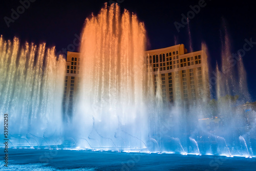 Las Vegas City Nightscape with red and blue night water fountain display in Nevada, USA