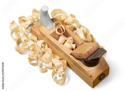 Old wooden plane and chips on a white background.