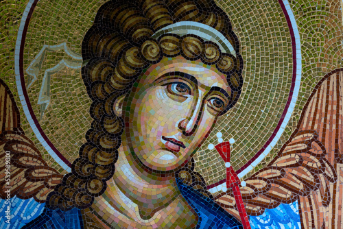 Detail of byzantine or orthodox mosaic icon depicting the head of an Angel.