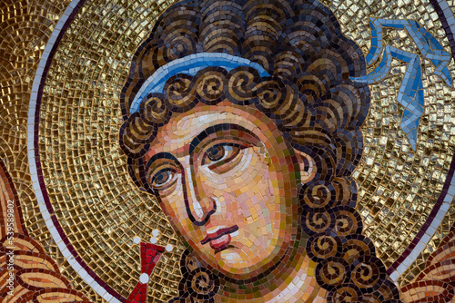 Detail of byzantine or orthodox mosaic icon depicting the head of an Angel.