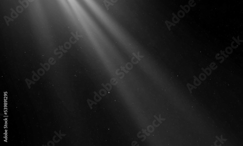 Show spotlights with glow effect on dark background.