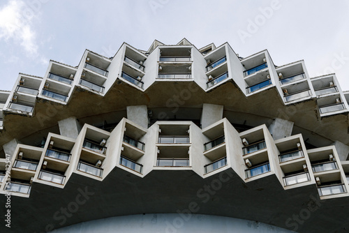 YALTA, Crimea - March 4, 2022: Beautiful modern concrete round building in cogwheel style of Kurpaty sanatorium in Yalta