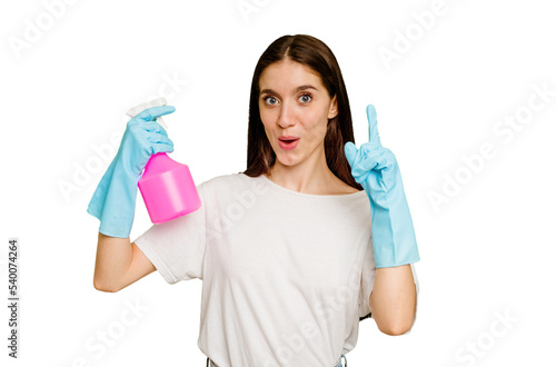 Young cleaner woman isolated having some great idea, concept of creativity.