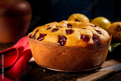 Tasty homemade cornmeal cake with guava pieces, with sliced ​​cake piece, selective focus and closeup