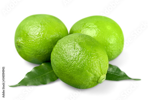 Three ripe green limes isolated on white background