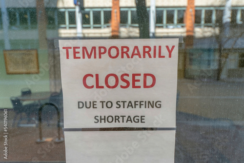 San Antonio, Texas- Selective focus of a signage with Temporarily Closed Due to Staffing Shortage