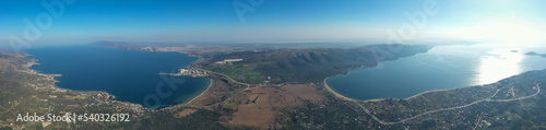 Aerial view of Erdek Kapidag peninsula and bay from top with blue sky and sea