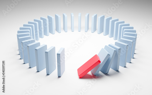 Domino effect. Dominoes placed in a circle and falling