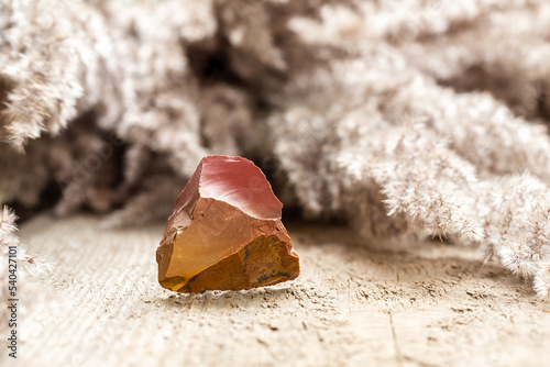 Red and Orange Flint Rock Specimen on Wood