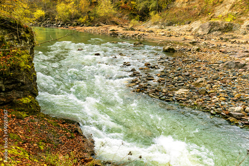 The bed of a fast mountain river on a rolling