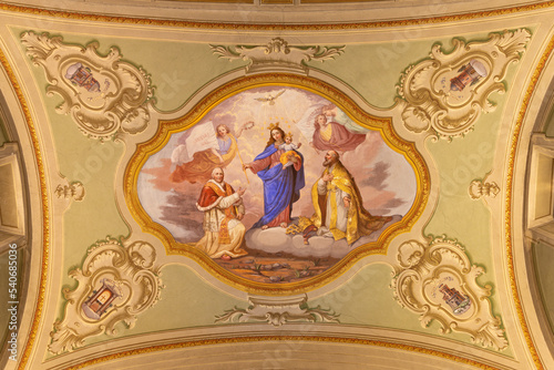 COURMAYEUR, ITALY - JULY 12, 2022: The ceiling fresco of Madonna among the saints in church in the church Sanctuary of Notre Dame de Guerison by Giuseppe Stornone (1816 - 1890).