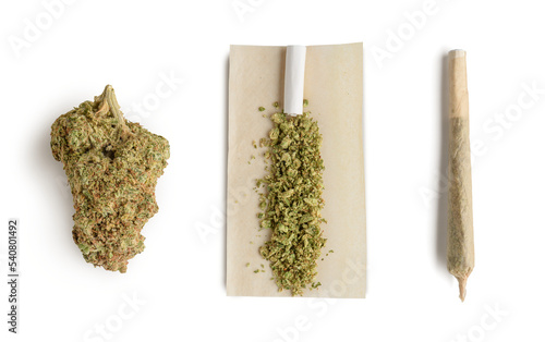 Marijuana bud ,crushed bud of marijuana on the rolling paper and rolling cannabis joint. 