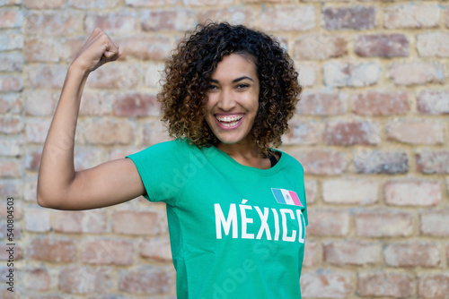 Optimistic mexican female football fan