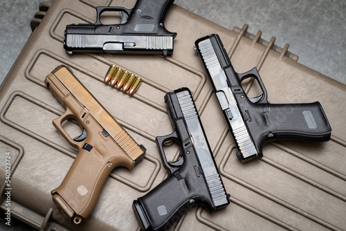 Weapons, many 9mm pistols close-up.