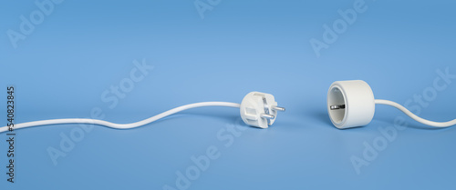 Blackout or disruption concept: Separated Plug and Socket in white.lying on a blue background