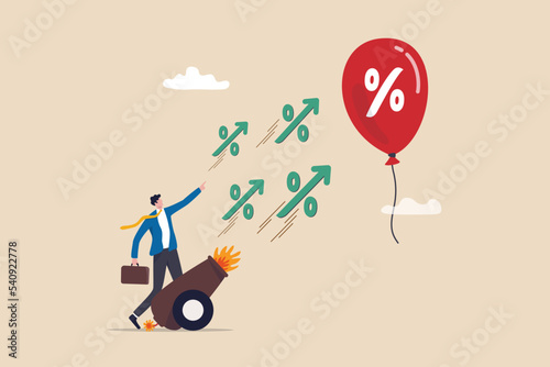 Inflation reduction act by FED, Federal Reserve and central bank to raise interest rate, monetary policy to control inflation, businessman banker shooting interest rate cannon at inflation balloon.