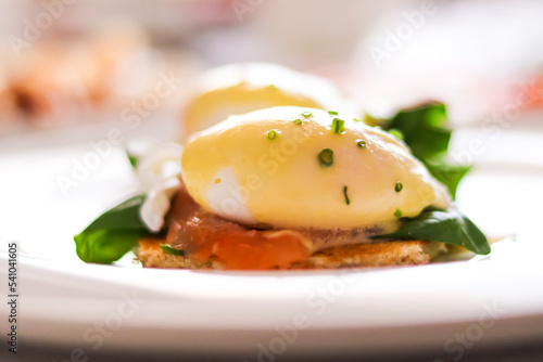 Luxury breakfast, brunch and food recipe, poached eggs with salmon and greens on gluten-free toast for restaurant menu and gastronomy branding