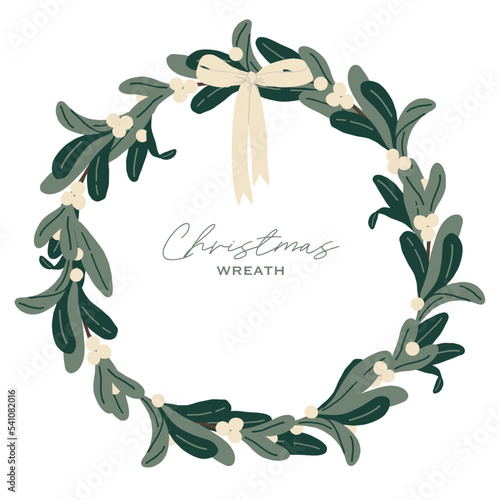 Christmas wreath with viscum and white bow.