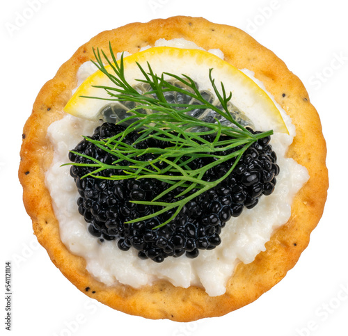 Black Caviar on egg white with Sour Cream and biscuit isolated on white background, Black caviar served on crackers with egg white on white With clipping path.