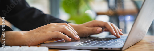 Woman hands typing on computer keyboard closeup banner, businesswoman or student girl using laptop at home, online learning, internet marketing, working from home, office workplace freelance concept.