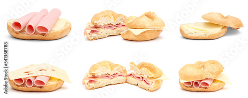 Set of delicious kaiser rolls with butter, ham and cheese isolated on white