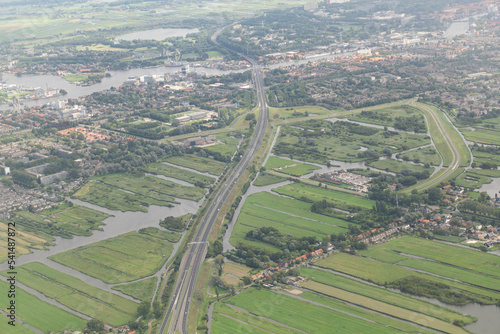 Netherlands higway near to countryside and polders at amsterdam city outsides viewed from an airplane