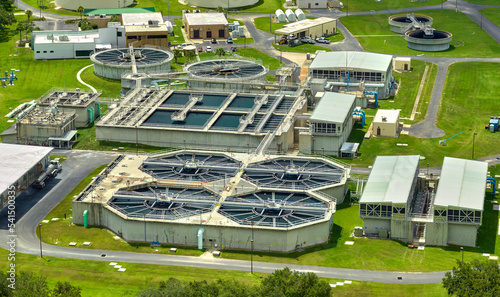 Aerial view of modern water cleaning facility at urban wastewater treatment plant. Purification process of removing undesirable chemicals, suspended solids and gases from contaminated liquid