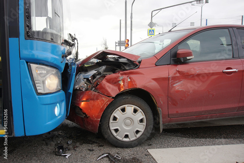 Frontal collision of a car and a bus. Head-on collision between bus and car. Car accident. Traffic accident.