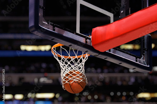 Basketball shot to the hoop in a competitive game at stadium