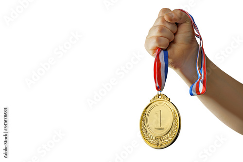 woman hand raised, holding gold medal on isolated free PNG background award and victory concept