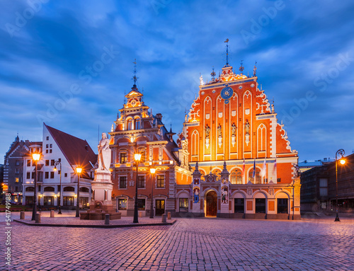 Riga Town Hall Square, House of the Blackheads and St. Roland Statue illuminated in the evening twilight, Riga, Latvia