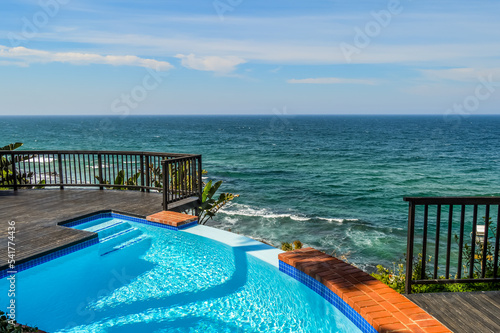 Outdoor jacuzzi and luxurious spa bath and infinity pool along Atlantic ocean in Ballito South Africa