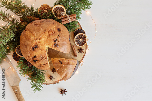 Panettone, traditional italian Christmas sweets for winter holidays celebration. Cristmas desert, festive dinner concept