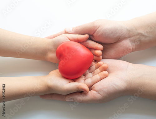 boy holding white heart in palm. Organ donation and insurance concept. World heart health concept. World organ donation day. Concept of healthy heart for healthy life. selective focus