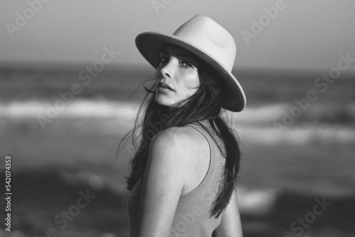 beautiful woman in hat on the beach in varna bulgaria, model shooting