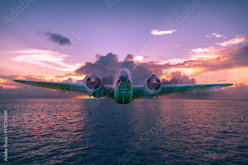A Lockheed Hudson Bomber goes for a sunset flight over an ocean. Digital art - this plane is actually on display at the North Atlantic Aviation Museum in Gander, Newfoundland.