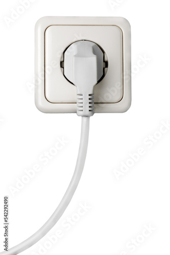 White electrical plug in the electric socket on a wall